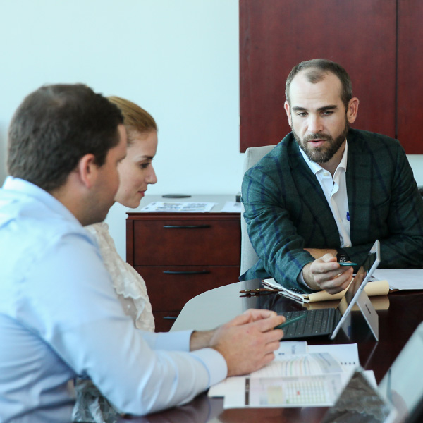A man's hands gesturing during a business meeting