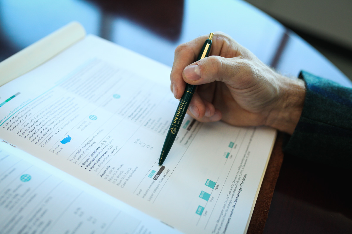 A man's hands gesturing during a business meeting