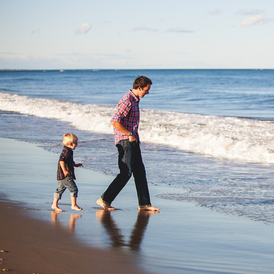 Father and son on beach